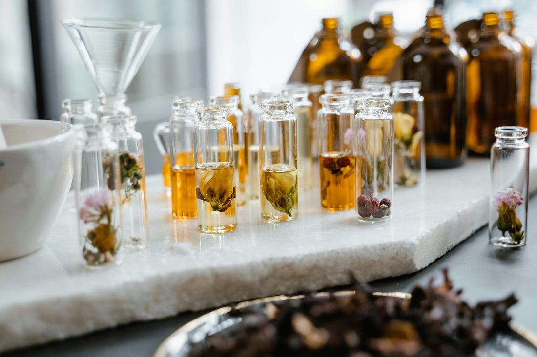 Natural ingredients and best retinol products for sensitive skin displayed in glass vials and bottles